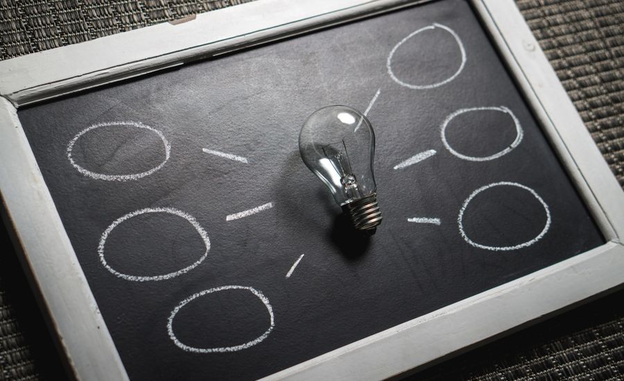 Chalkboard with a lightbulb — research and academic publication