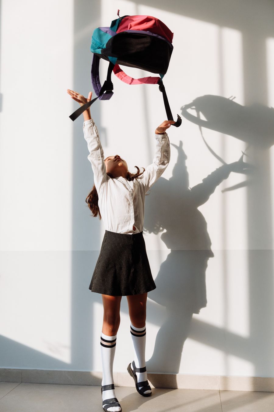School student in uniform with a backpack